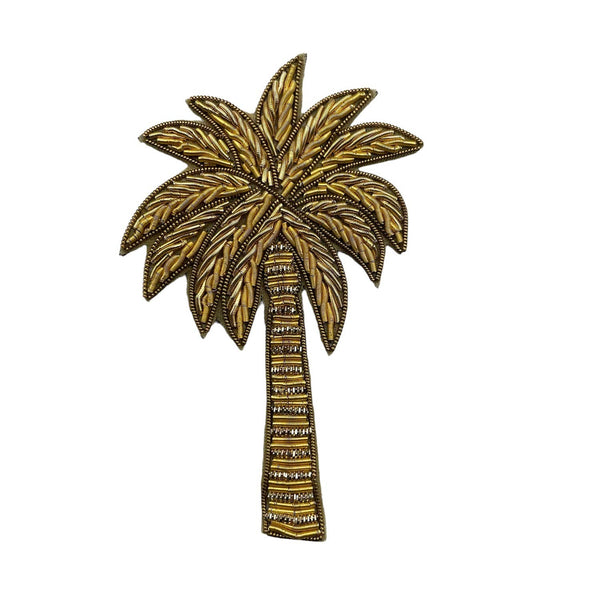 Bolsa de maquillaje Tribeca naranja con un alfiler dorado en forma de palmera